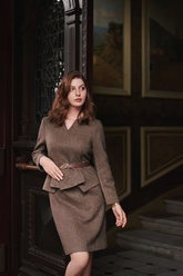 a lady in a brown wool faux tow-piece set with a belt
